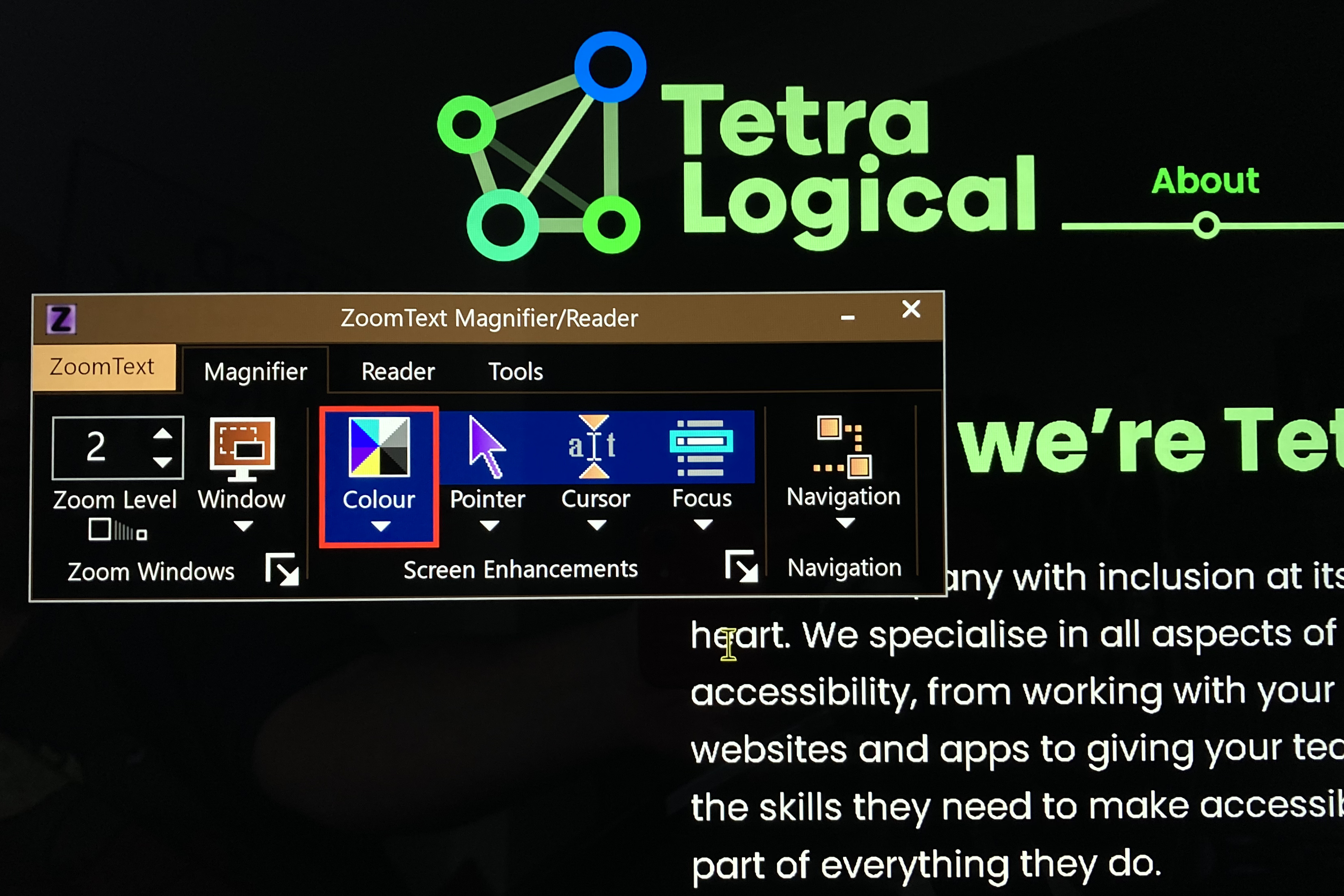 The TetraLogical homepage with ZoomText settings over the page with inverted colours