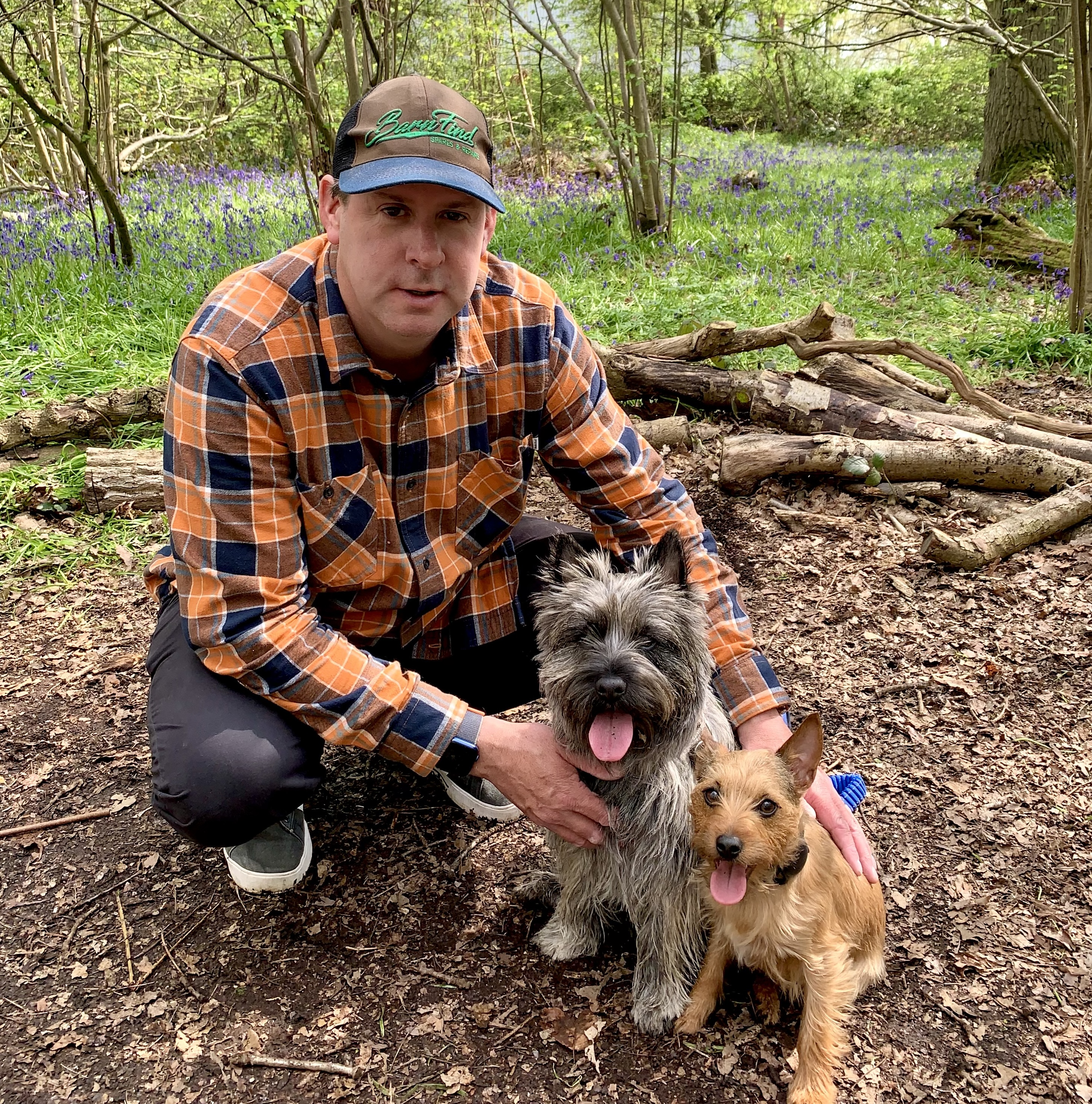 Lloydi with his two dogs, Roxy a Cairn Terrier with a shaggy grey, brindle coat and Rambo, a little pipsqueak of a dog that barely lives up to his name